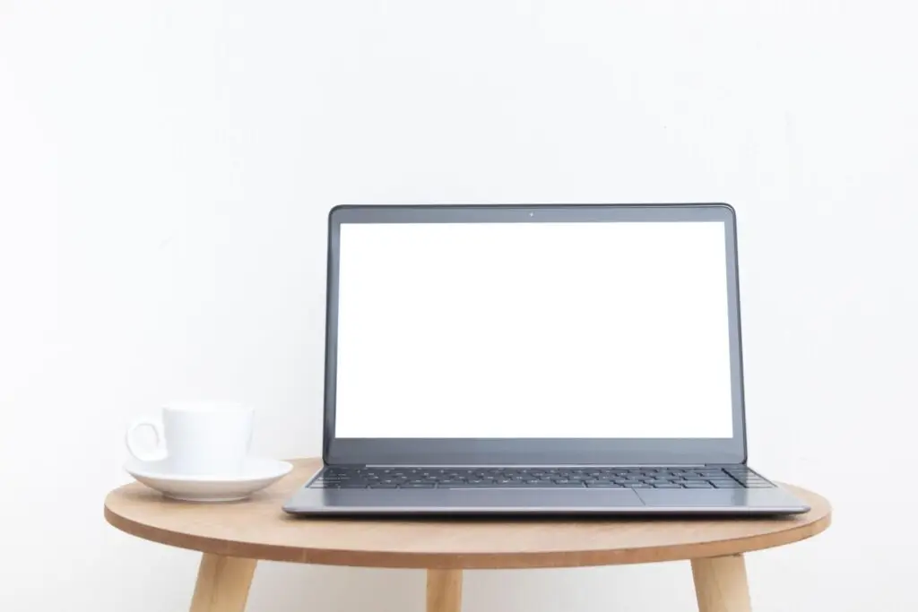 Modern website design agency workspace with laptop and desk setup